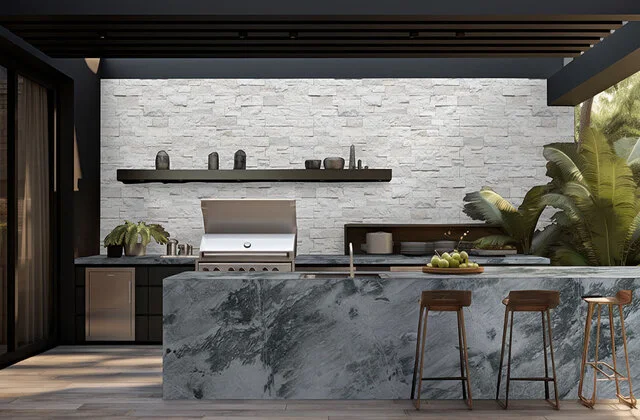 Gray quartzite island and countertops installed in an outdoor kitchen